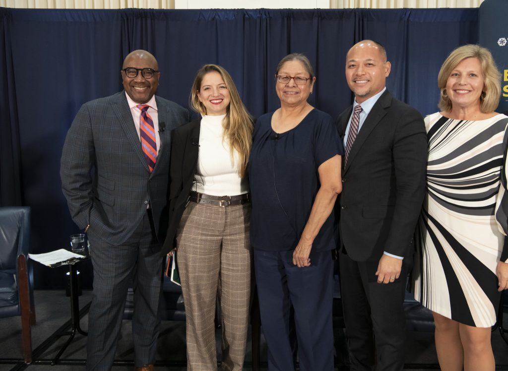 panelists and moderator posing for picture