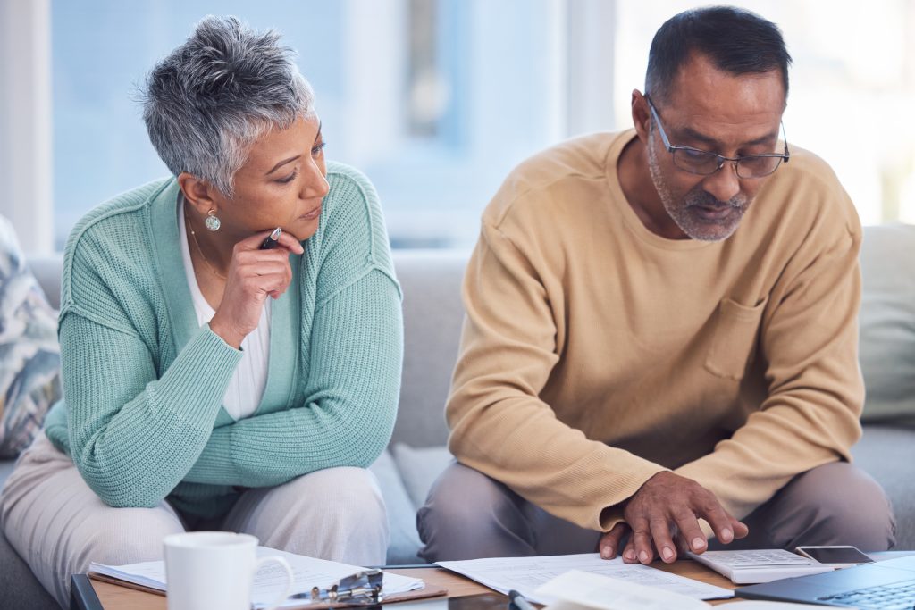 Finance, insurance and senior couple with documents, planning tax and home budget with a laptop. Ecommerce, strategy and elderly man and woman banking during retirement online with pension savings